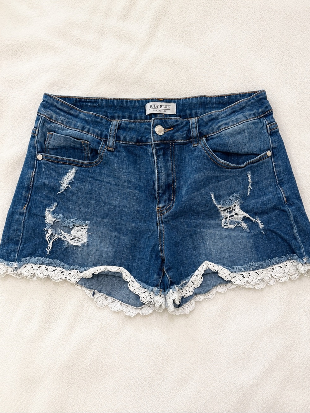 Judy Blue Distressed Blue Denim Shorts with White Lace Hem
